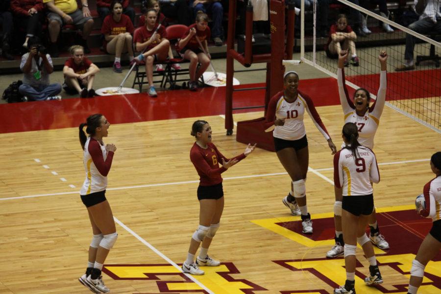 The team celebrates as they score during the 5th set of the game against the North Carolina Tarheels on Nov. 30, 2012 at Hilton Coliseum.
