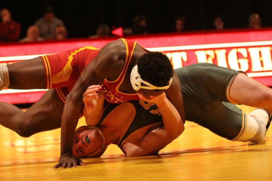 Kyven+Gadson+tries+to+get+his+opponent+turned+in+the+197-pound+match+of+Iowa+States+come-from-behind+dual+meet+victory+against+North+Dakota+State+on+Sunday%2C+Dec.+16%2C+2012.+Gadson+was+the+third+of+four+straight+Cyclone+victories+that+spurred+the+22-18+victory.%0A