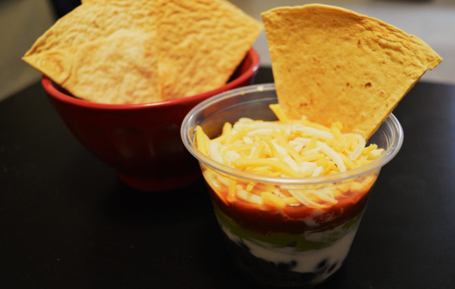 Enjoy a layered taco dip in a perfect one serving cup to help control portions. 
