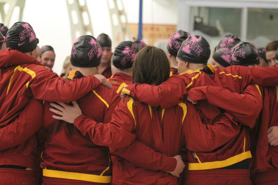 The swimming and diving team huddles up before the dual swim meet against Nebraska and South Dakota on Friday, Oct. 26, at Beyer Hall. Iowa State defeated South Dakota 246-53 but fell to Nebraska 122.5-176.5.
