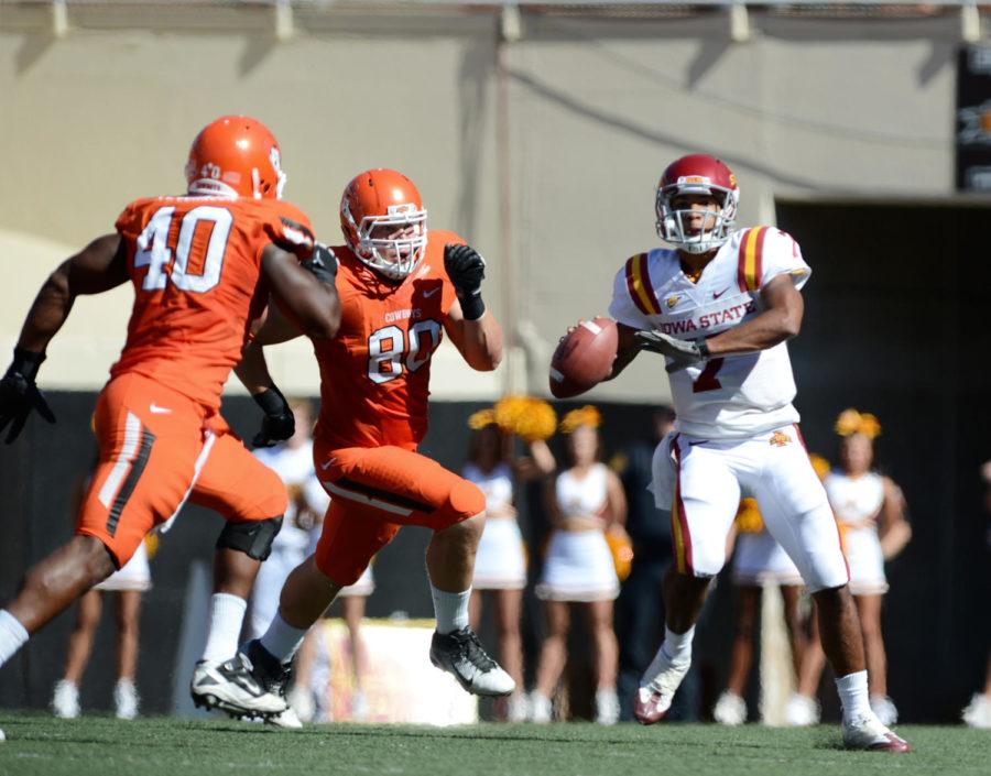 ISU quarterback Jared Barnett attempts to escape the pass rush in the Cyclones 31-10 loss to Oklahoma State on Saturday, Oct. 20, at Boone Pickens Stadium. Barnett completed 19-of-39 passes for 206 yards for one touchdown and one interception.
