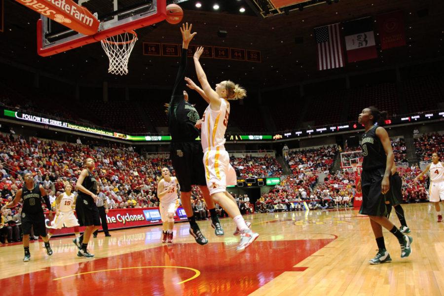 Senior center Anna Prins sneaks a shot past Baylors Brittney Griner on Jan. 23, 2012, at Hilton Coliseum.  The Cyclones trail 16-31 at halftime.
