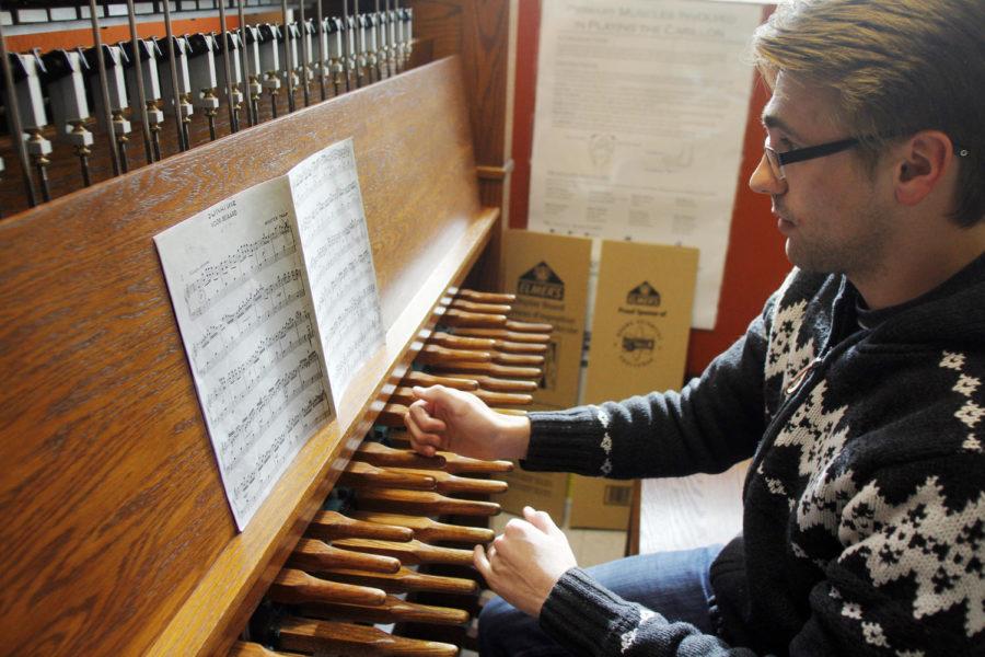 Josh Hellyer, senior in community and regional planning, practices playing the campanile under the instruction of Dr. Tin-Shi Tam on Jan. 22 in the Music Hall. The instrument at the Music Hall is identical to the one in the Campanile, but sounds a bit different.
