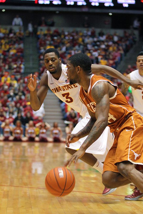 Iowa States Melvin Ejim chases after Texas Julien Lewis. The Cyclones won against the Longhorns with a score of 82-62.
