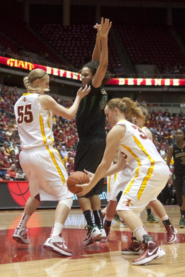 Cyclone forward Chelsea Poppens manages to grab the ball after center Anna Prins successfully blocks Brittney Griners shot Saturday, Jan. 7, 2012 at Hilton Coliseum. 
