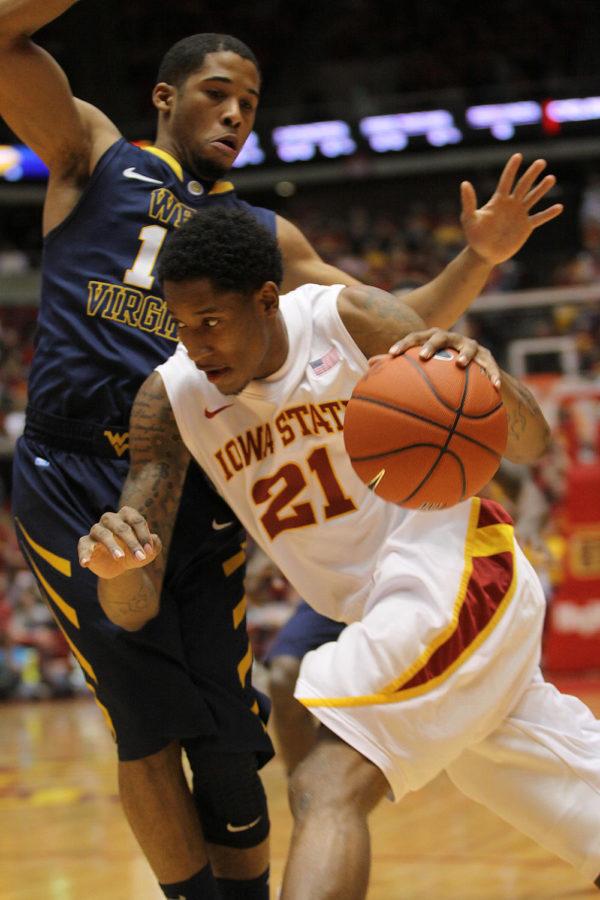 
ISU guard Will Clyburn drives the court to avoid the the West Virginia defense. Clyburn was one of the top scorers of the game. The Cyclones won with a score of 69-67.

