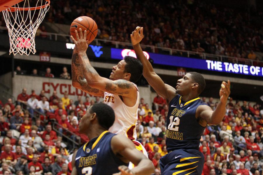 ISU+guard+Chris+Babb+shoots+the+ball+while+avoiding+the+West+Virginia+defense+on+Jan.+16.+The+Cyclones+beat+the+Mountaineers+69-67+with+a+game-winning+shot+with+2.5+seconds+remaining.%C2%A0%0A
