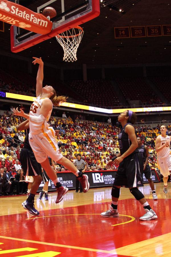 Senior forward Chelsea Poppens goes up for the layup against TCU on Jan. 12, 2013, at Hilton Coliseum.  Poppens reached a double-double by halftime and finished with 24 points and 15 rebounds in the 68-52 victory.
