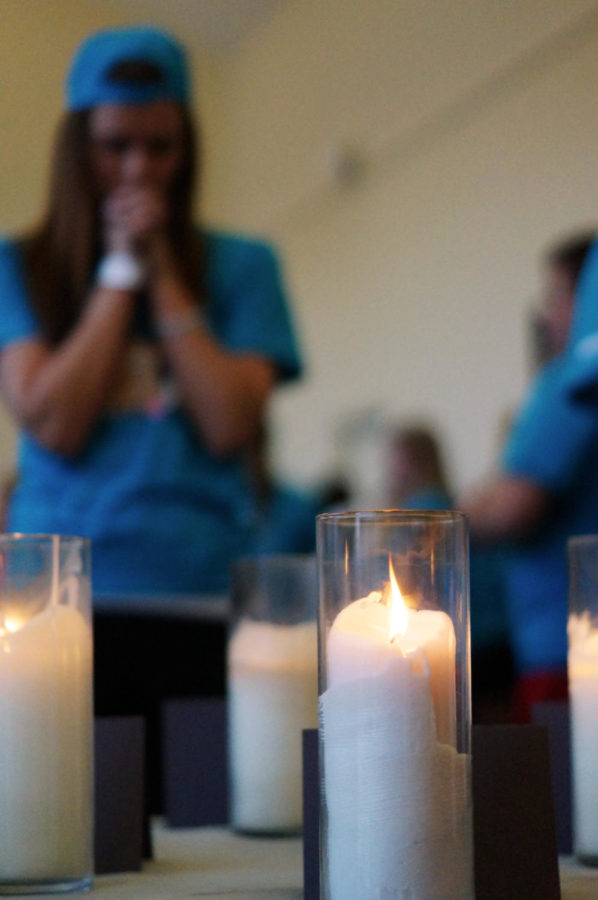 A student looks at the candles in the Why We Dance room at Iowa States Dance Marathon on Jan. 26, 2013.
