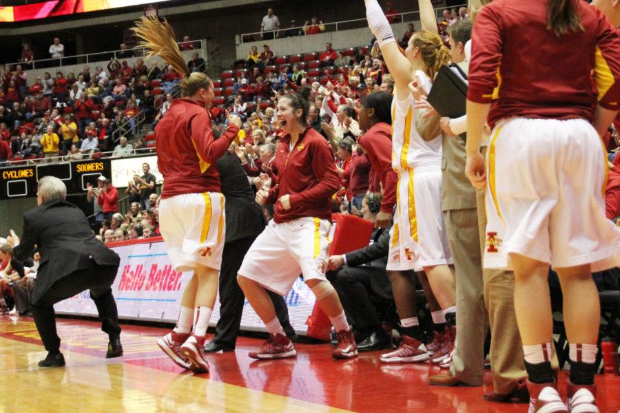 The Cyclone bench celebrates a basket as they extend their lead against Oklahoma. The Cyclones beat the 16th-ranked Sooners 82-61.
