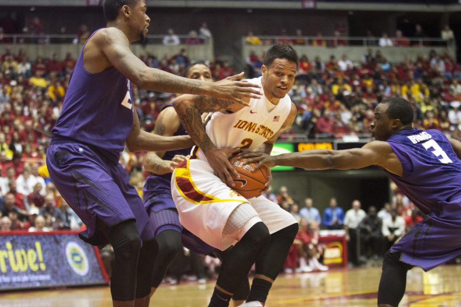 ISU guard Chris Babb holds onto the ball as three Kansas State players try to strip it away from him during the Cyclones 73-67 win against Kansas State on Saturday, Jan. 26, 2013 at Hilton Coliseum.
