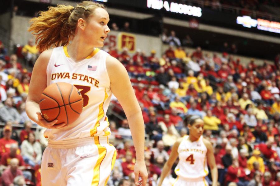 Senior Chelsea Poppens transitions with the ball out of bounds. Poppens scored 22 points in the Cyclones 83-68 victory on Feb. 27, 2013, at Hilton Coliseum. 
