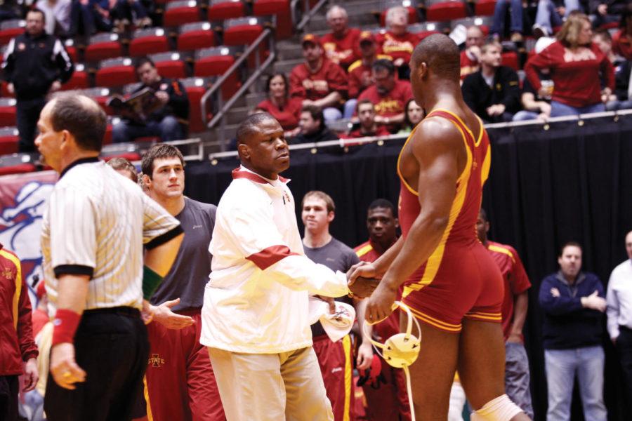 Head coach Kevin Jackson shakes Matt Gibsons hand after his
match. Gibson wrestled in a close match with Wisconsins
heavyweight and won with a final score of 5-2. The ISU wresting
team held the Iowa State Regional this weekend on Sunday. The team
matched up against the Wisconsin Badgers and won with a final team
score of 33-3. 
