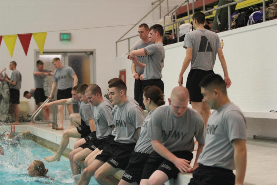 ROTC members sit on the edge of the pool in preparation for Combat Water Survival Training on Feb. 20 in Beyer Hall.
