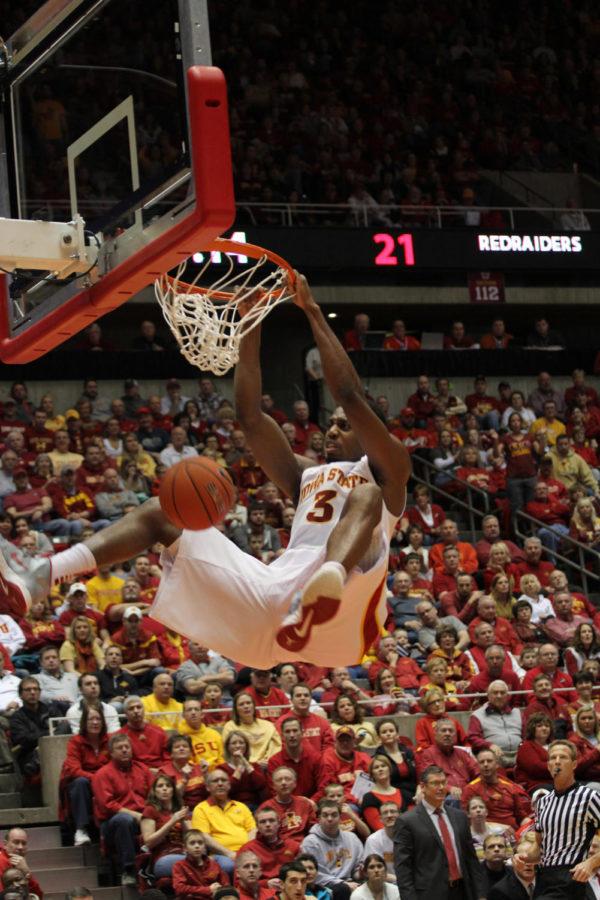 Melvin Ejim takes the the Red Raiders by surprise with a slam dunk during the first half of the game. The Cyclones defeated the Texas Tech Red Raiders 86-66 on Feb. 23 at Hilton Coliseum.
