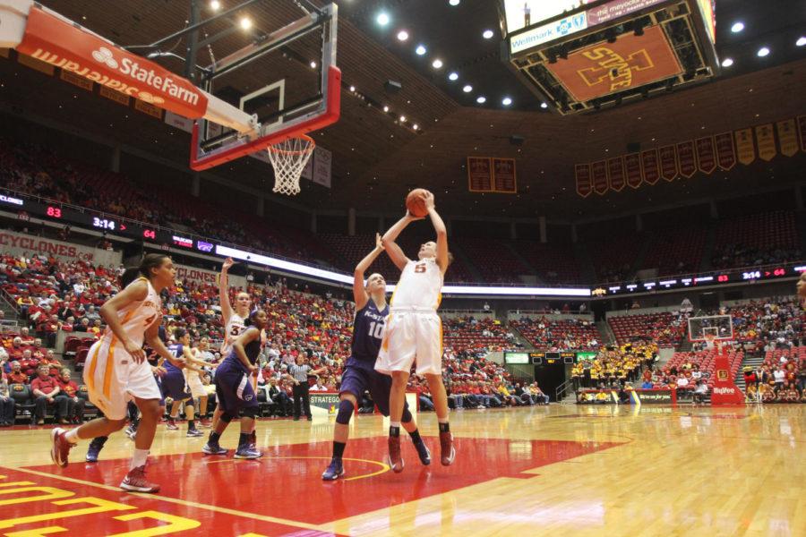 Hallie Christofferson pushes through Kansas States defense for a layup. Christofferson led the team with 25 points at the 87-71 win against Kansas State on Feb. 9 at Hilton Coliseum.
