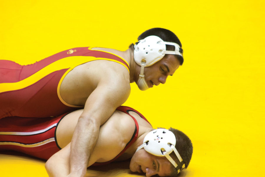 Michael Moreno holds his opposition to the ground Saturday, Nov. 10, in the Harold Nichols Cyclone Open at Hilton Coliseum.
