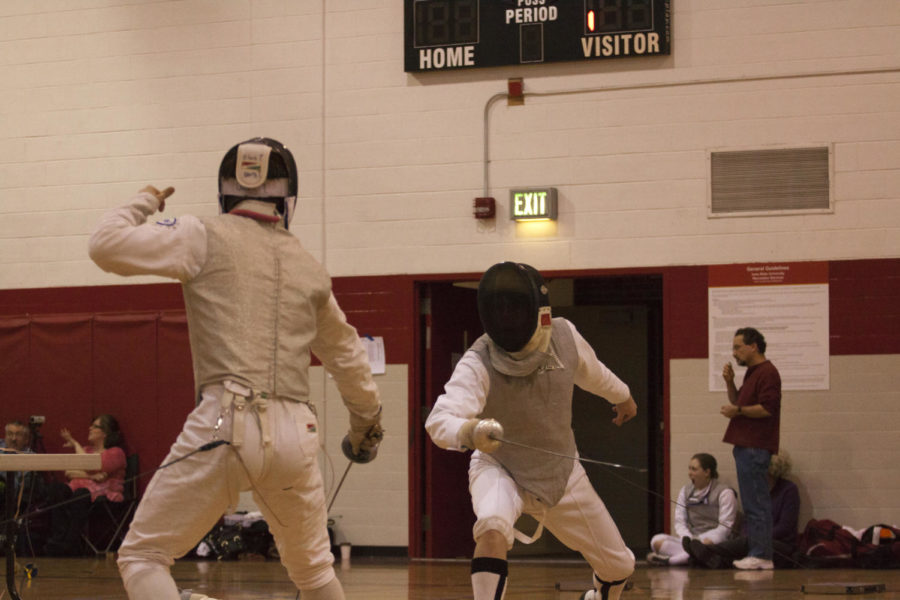 Mitchel Grundmeier, member of the ISU Fencing Club, duels his opponent  at the fencing meet Feb. 9 in Beyer Gym.
