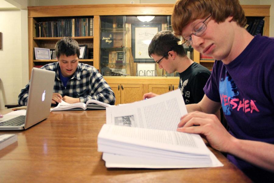 Acacia Fraternity brothers Tanner Jaeger, sophomore in chemical engineering, Ryan Lohse, sophomore in management information systems, and Addison Kistler, junior in mechanical engineering, study together in their house to try for better GPAs. 
