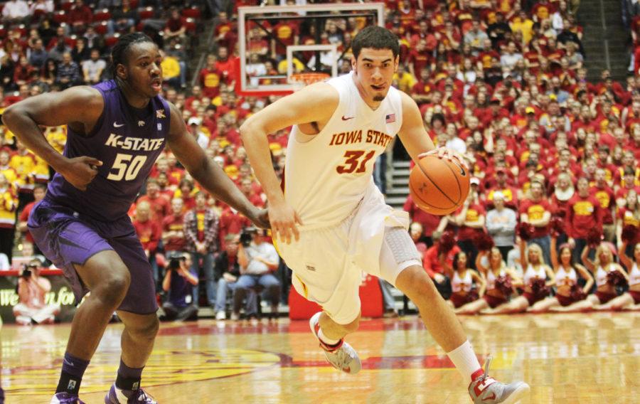 ISU forward Georges Niang dribbles past a Wildcat defender in Iowa States win against Kansas State on Saturday, Jan. 26, 2013 at Hilton Coliseum. The Cyclones won 73-67. 
