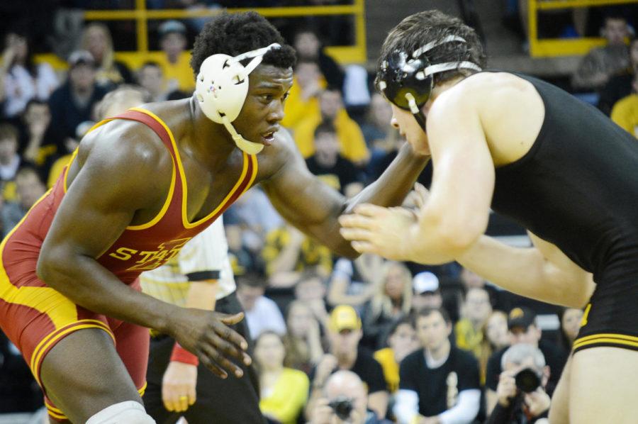 Iowa+States+Kyven+Gadson+grapples+with+University+of+Iowas+Nathan+Borak+during+their+197-pound+match+at+the+meet+Saturday%2C+Dec.+1%2C+at+Carver-Hawkeye+Arena+in+Iowa+City.%0A