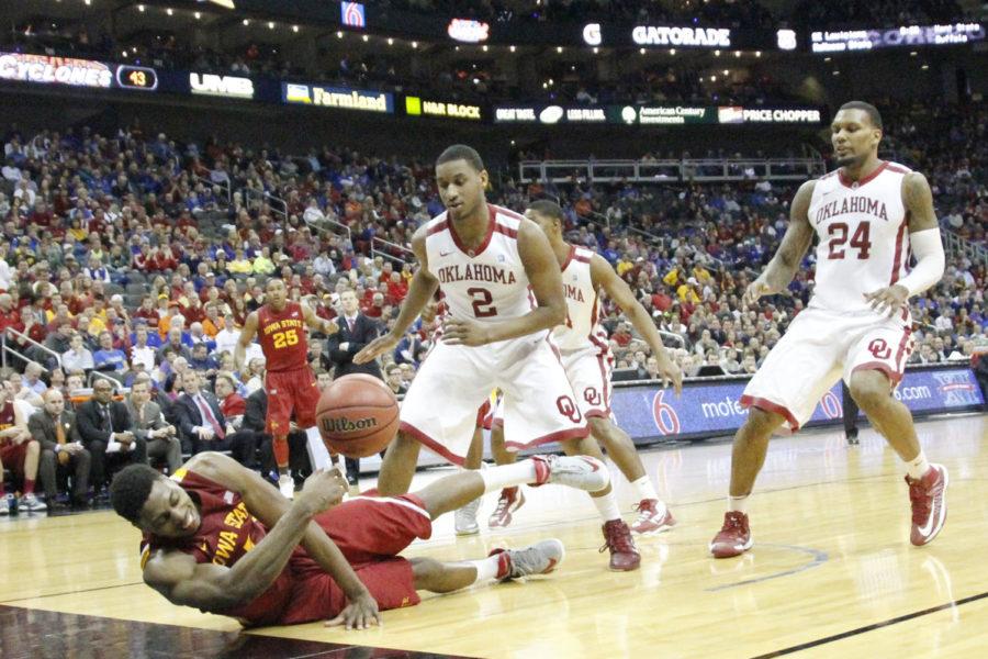 Junior Melvin Ejim dives to save the ball against Oklahoma in the second round of the Big 12 Mens Basketball Championship on March 14, 2013, at the Sprint Center in Kansas City, Mo. Ejim was called out on the play in the 73-66 win.
