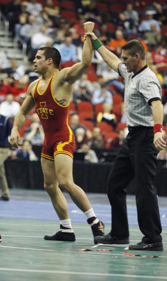 Redshirt sophomore Michael Moreno is declared the winner after pinning Ohio States Mark Martin in the 165-pound wrestlebacks at the NCAA Wrestling Championships at Wells Fargo Arena in Des Moines. Moreno pinned Martin in 4:27.
