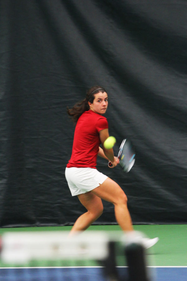 Senior Simona Cacciuttolo returns the ball during the meet against Baylor on Friday, March 15, 2013, at Ames Racquet & Fitness.

