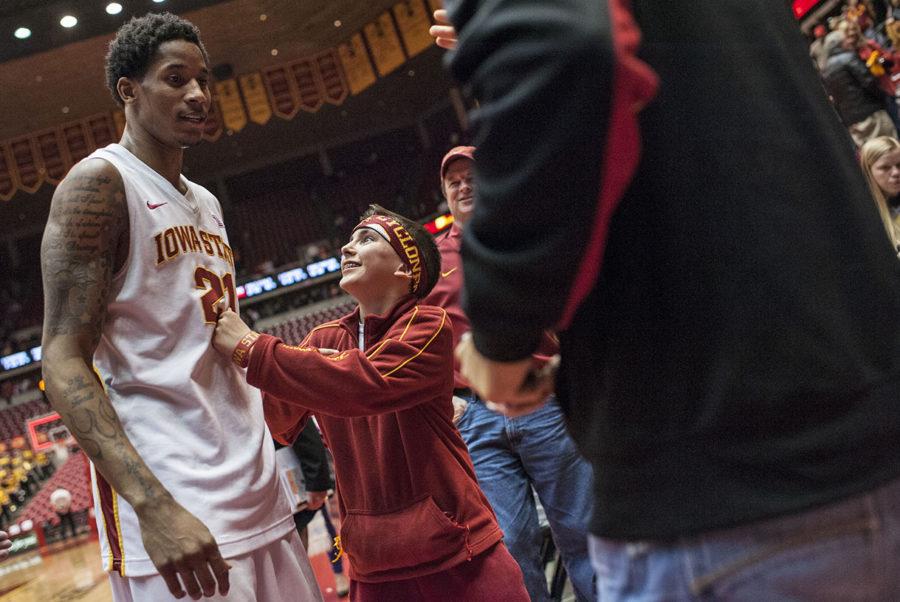 A+young+ISU+fan+congratulates+ISU+mens+basketball+guard+Will+Clyburn+after+the+game+against+Oklahoma+State+on+Wednesday%2C+March+6%2C+2013%2C+at+Hilron+Coliseum.+Iowa+State+won+the+game+with+the+final+score+87+to+76.%0A