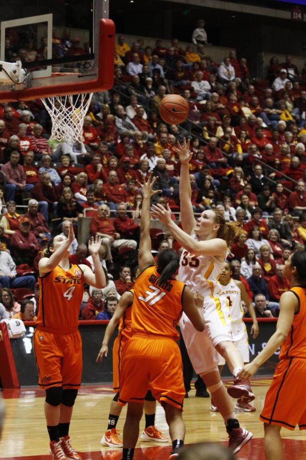 Chelsea Poppens drives the ball to the basket on Monday March 4, 2013, for the win 73-70 against OSU Cowgirls at HIlton Coliseum. Poppens had 18 points for the night.
