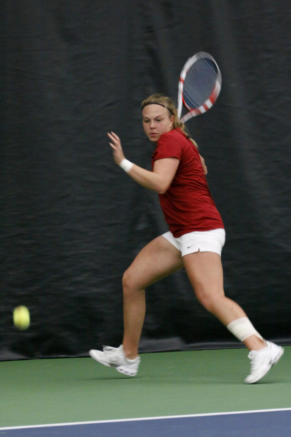 Ksenia+Pronina+focuses+on+the+ball+and+prepares+to+hit+it+at+the+match+against+Drake+5-2+on+Friday%2C+March+8%2C+2013%2C+at+Ames+Racquet+and+Fitness.%0A