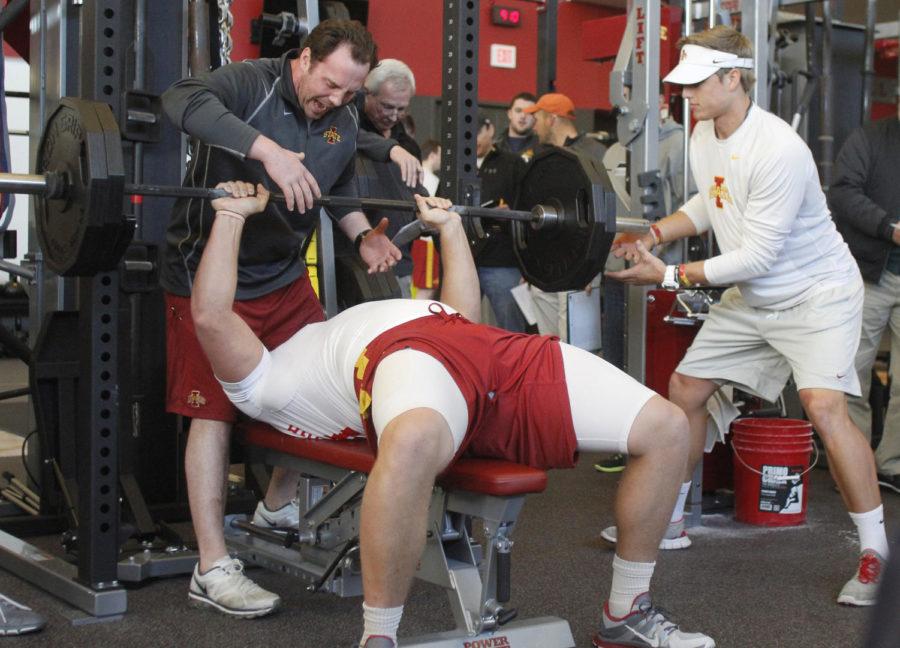 Former defensive lineman Jake McDonough bench presses 225 pounds in 37 reps as NFL scouts observe the workouts during Pro Day at the Bergstrom Facility on Tuesday, March 26, 2013.
