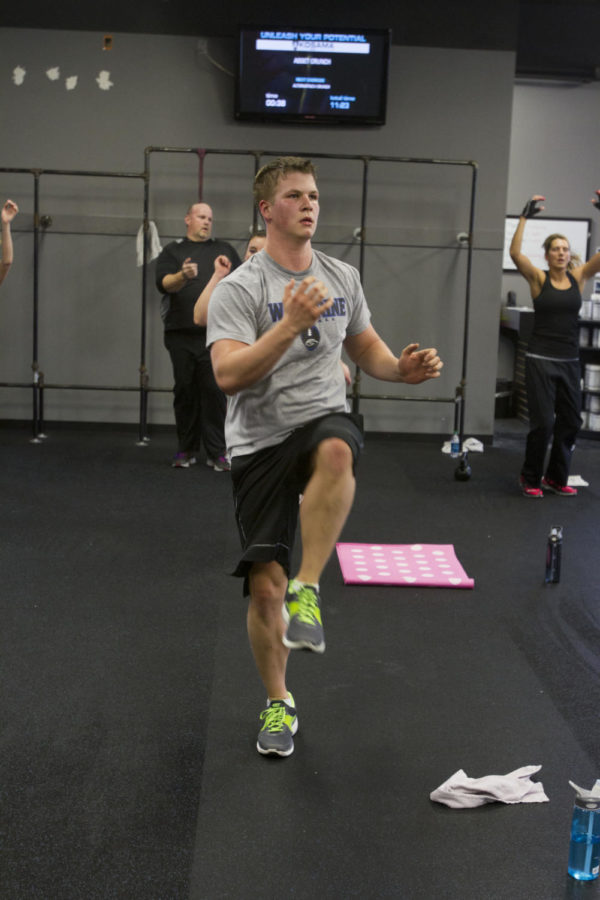 IV Githens does leg lifts during the hour-long exercise session Feb. 28 at Kosama on Main Street.

