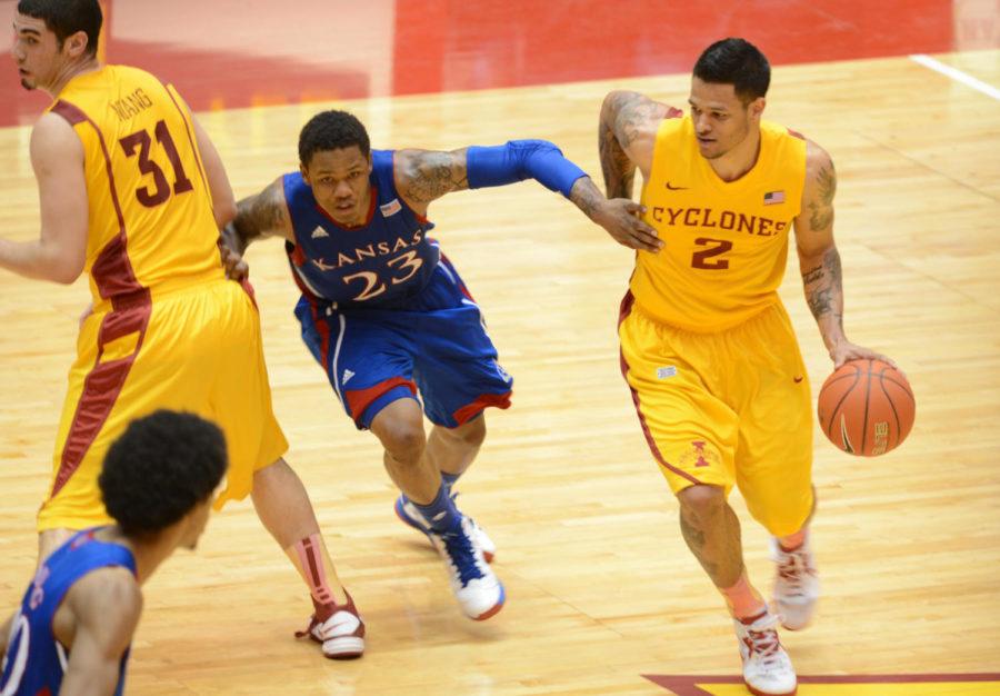 Chris Babb runs the ball during the loss 108-96 against Kansas on Feb. 25 at Hilton Coliseum. Babb had a total of 11 points at the game. 
