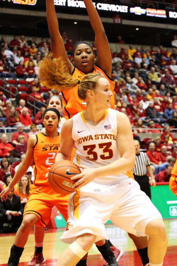 Senior Chelsea Poppens looks to pass during against Oklahoma State on Monday, March 4, 2013, at Hilton Coliseum. The Cyclones won 73-70.
