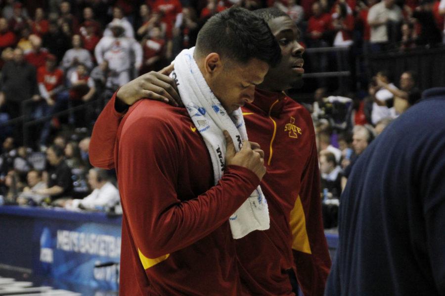 ISU redshirt senior Chris Babb is helped off the court by teammate freshman Nkereuwem Okoro after the Cyclones 75-78 loss to Ohio State in the last second of the third-round game of the NCAA tournament on March 24, 2013, at the University of Dayton Arena. Babb was injured in the first half and did not play the second half of his final game as a Cyclone.
