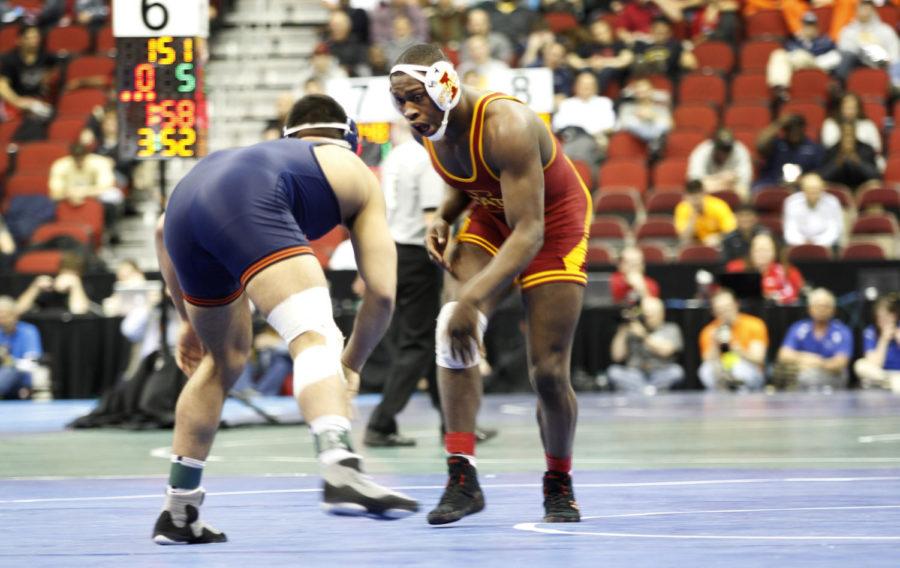 Redshirt sophomore Kyven Gadson sets up an impending attack on Illinois Mario Gonzalez in the first round at 197 pounds at the NCAA Wrestling Championships on Thursday, March 21, 2013, at Wells Fargo Arena in downtown Des Moines. Gadson pinned Gonzalez in 1:41, receiving a standing ovation after doing so.
