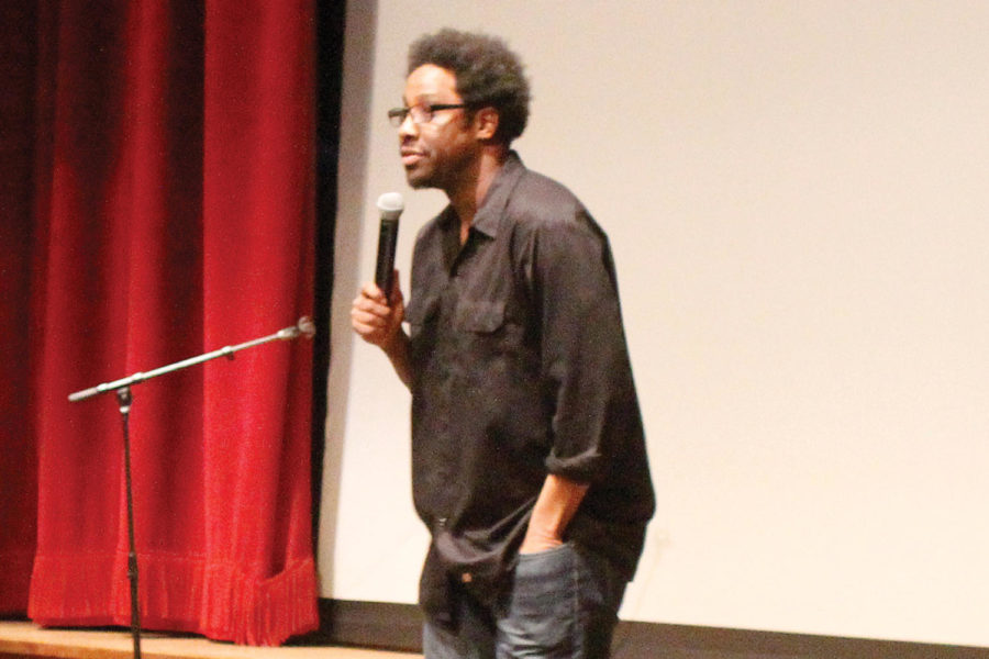 W. Kamau Bell, host of FXs Totally Biased, talks to the crowd Monday, March 4, 2013, in the Great Hall in the Memorial Union. Mixing comedy with topics of racism and history, Bell seeks to entertain as well as inform.
