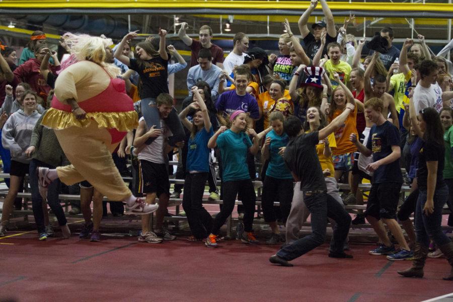 Jared Brackens, sophomore interdisciplinary studies, also known to students as Gladis Hefty, gets some air during the Harlem Shake at Relay for Life on Friday, March 8, 2013, at Lied Recreation Center.
