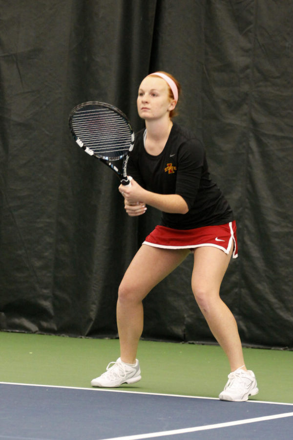 Meghan Cassens gets ready to recieve the ball at the win against Grand View 7-0 on Saturday, March 9, 2013, at Ames Racquet and Fitness.
