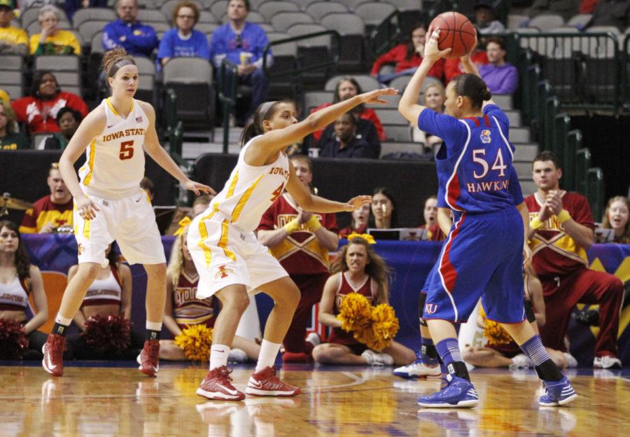 ISU women’s basketball guard Nikki Moody attempts to block Kansas guard Markisha Hawkins during the first half of the game against the Kansas Jayhawks on March 9, 2013, at the American Airlines Center in Dallas, Texas. The Cyclones defeated the Jayhawks with a final score of 77-62.
