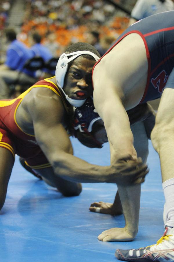 Redshirt sophomore Kyven Gadson attempts to get ahold of Pennsylvania’s Micah Burak during the fifth round wrestlebacks at 197 pounds at the 2013 NCAA Wrestling Championships on Friday, March 22, 2013, at Wells Fargo in Des Moines. Gadson defeated Burak, 4-3.
