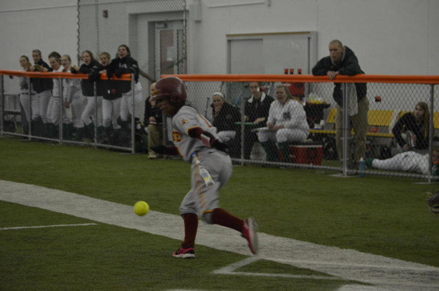 After hitting the ball, Brittany Gomez runs to first base Feb. 8 at the Bergstrom Football Complex.  Iowa State won 11-1 against University of North Dakota.

