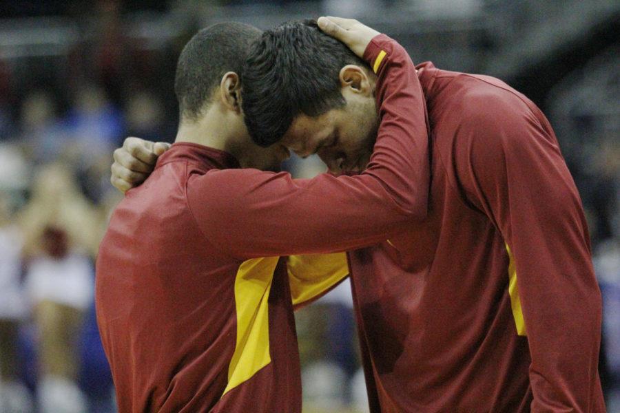 Senior Austin McBeth and redshirt senior Chris Babb pray before the beginning of the Iowa State vs. Oklahoma Big 12 tournament game on March 14, 2013, at Sprint Center. The Cyclones prayers were answered with a 25-6 run to end the game with a 73-66 victory.
