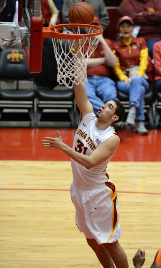 Georges Niang dunks the ball in the 87-76 win against Oklahoma State on Wednesday, March 6, 2013 at Hilton Coliseum. Niang had a total of 18 points at the game.