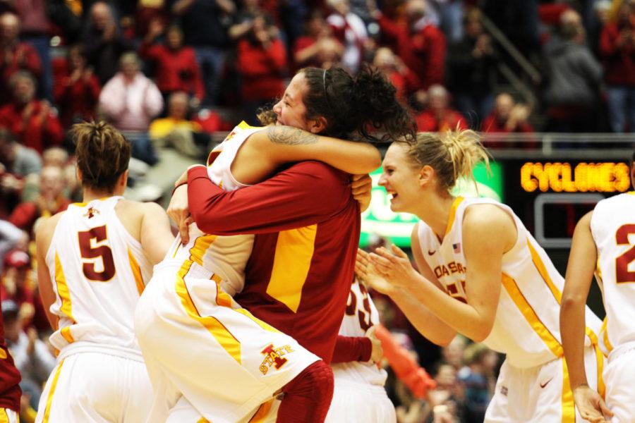 Teammates Nicole Kidd Blaskowsky and Madison Baier, both freshmen, celebrate their win against Oklahoma State on Monday, March 4, 2013, at Hilton Coliseum. The final score was 73-70.
