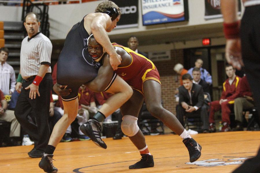 Redshirt sophomore Kyven Gadson shoots a double-leg on Oklahoma States Blake Rosholt in the 197-pound title match of the Big 12 Championships on Saturday, March 9, 2013, at Gallagher-Iba Arena. Gadson won the match 5-4 for the Cyclones only individual title.
