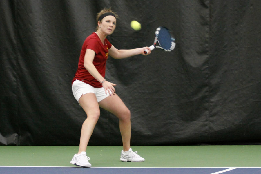 Jenna Langhorst prepares to return the ball at the match against Drake 5-2 on Friday, March 8, 2013, at Ames Racquet and Fitness.
