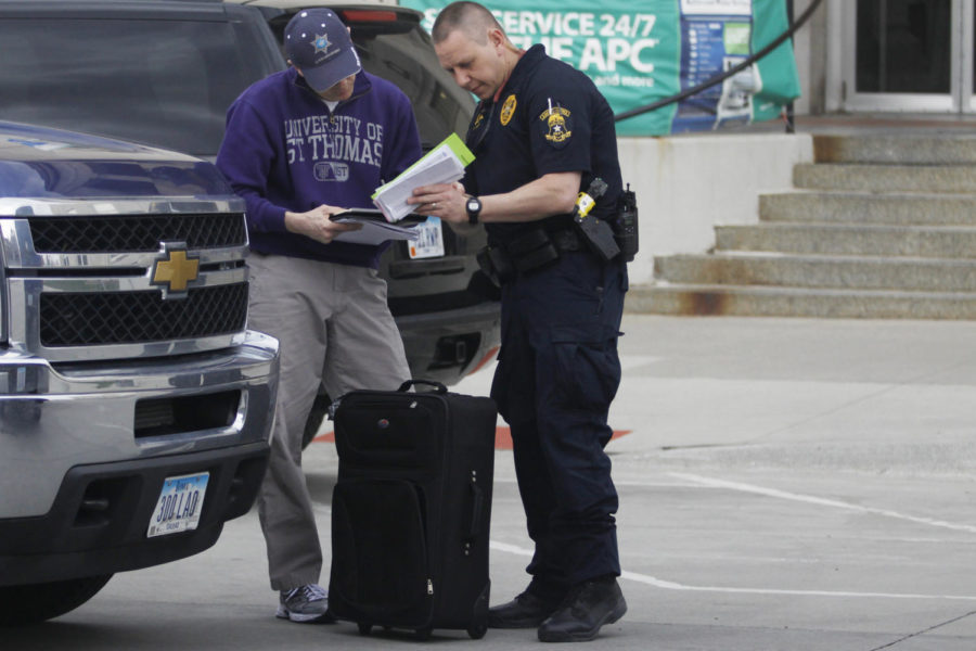 The Ames police and State Fire Marshal bomb squad look through paperwork left inside a suspicious bag on April 22, 2013 outside of the Ames Post Office. The bag was left unattended inside the building and reported to the police shortly after 3 p.m. 
