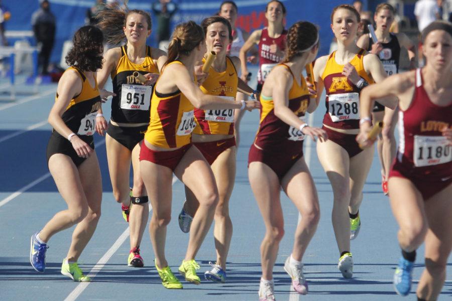 Redshirt sophomore Margaret Gannon hands the baton onto redshirt senior Dani Stack during the womens 4X1600 at the Drake Relays on April 25, 2013, at Drake Stadium. The relay finished in first place, giving the Cyclones their first win of the Drake Relays with a time of 19:16.69.

